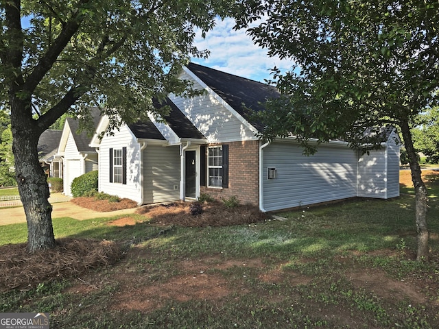 3075 Lakeside Cir, Covington, GA 30016 - view of front of home with brick siding and a front yard