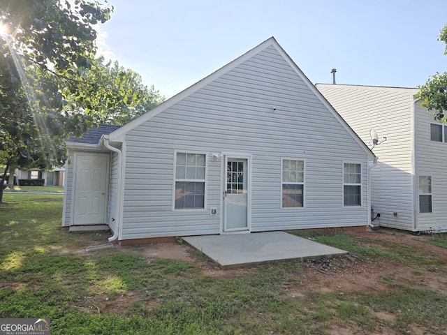 3075 Lakeside Cir, Covington, GA 30016 - rear view of property featuring a patio and a yard