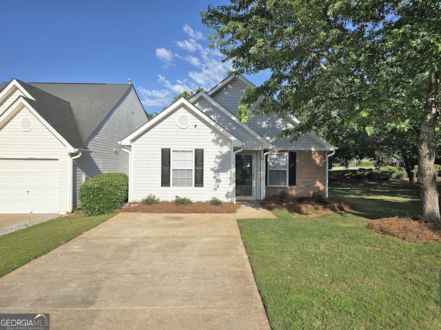 3075 Lakeside Cir, Covington, GA 30016 - view of front facade featuring a front lawn and a garage