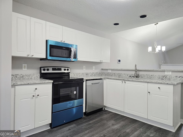 3075 Lakeside Cir, Covington, GA 30016 - kitchen featuring appliances with stainless steel finishes, a peninsula, dark wood-style flooring, a chandelier, and white cabinets