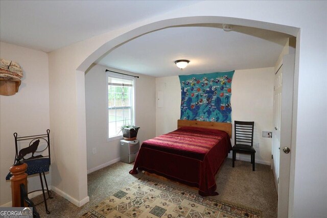 236 Hiram Sudie Rd, Dallas, GA 30157 - bedroom featuring arched walkways, light carpet, and baseboards