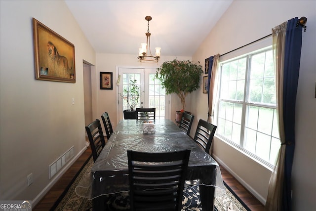 236 Hiram Sudie Rd, Dallas, GA 30157 - dining area with wood finished floors, lofted ceiling, baseboards, and a chandelier
