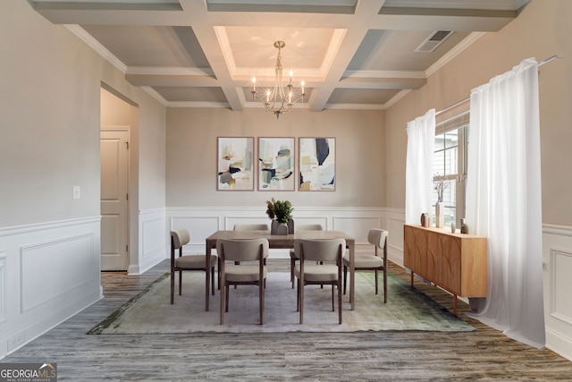 31 Blarneystone Way, Adairsville, GA 30103 - dining area with a chandelier, wood finished floors, coffered ceiling, beamed ceiling, and a decorative wall