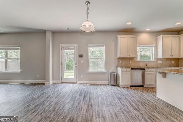 31 Blarneystone Way, Adairsville, GA 30103 - kitchen featuring dishwasher, light wood-style floors, baseboards, decorative backsplash, and white cabinets