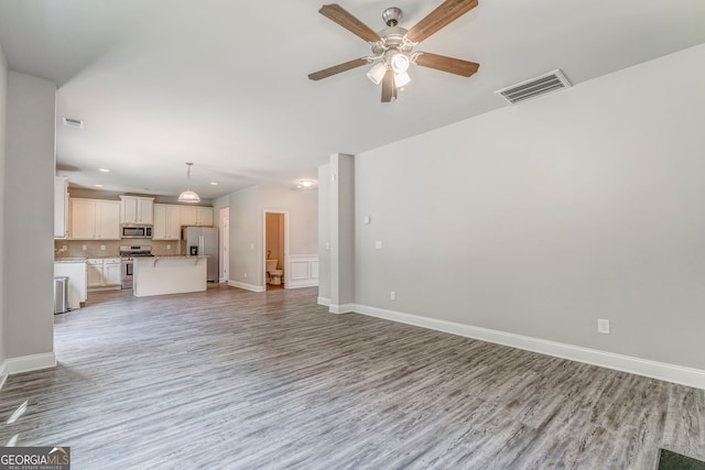 31 Blarneystone Way, Adairsville, GA 30103 - unfurnished living room featuring light wood-type flooring, a ceiling fan, recessed lighting, and baseboards