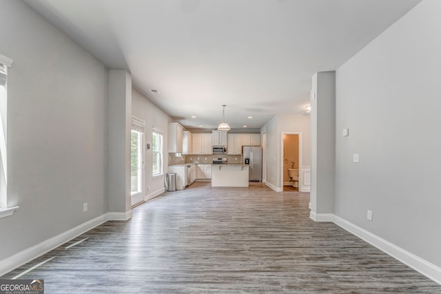 31 Blarneystone Way, Adairsville, GA 30103 - unfurnished living room featuring light wood finished floors, baseboards, and recessed lighting