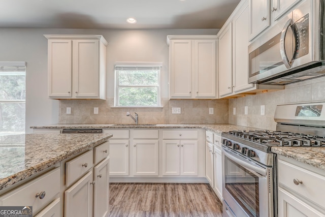 31 Blarneystone Way, Adairsville, GA 30103 - kitchen featuring appliances with stainless steel finishes, a sink, white cabinetry, recessed lighting, and backsplash