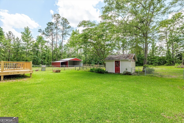 1055 Wrens Hwy, Thomson, GA 30824 - view of yard with a carport, a wooden deck, and view of scattered trees