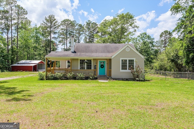 1055 Wrens Hwy, Thomson, GA 30824 - view of front of property with covered porch, driveway, and an outbuilding