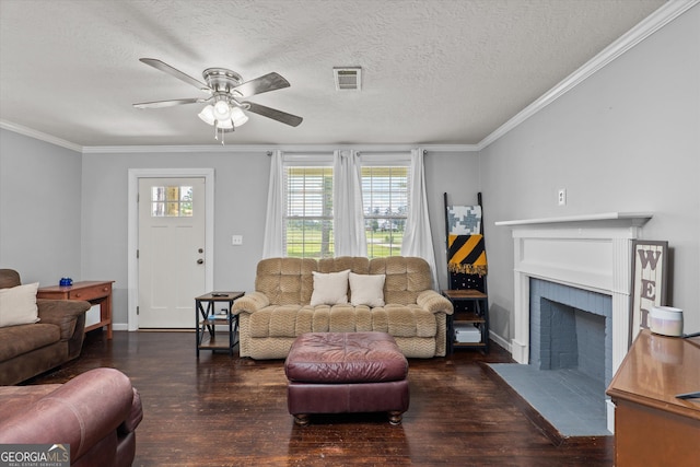 1055 Wrens Hwy, Thomson, GA 30824 - living room with wood finished floors, plenty of natural light, a ceiling fan, ornamental molding, and a textured ceiling