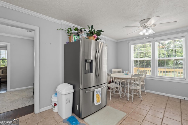 1055 Wrens Hwy, Thomson, GA 30824 - kitchen with stainless steel refrigerator with ice dispenser, plenty of natural light, a ceiling fan, light tile patterned floors, and a textured ceiling