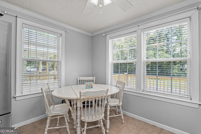 1055 Wrens Hwy, Thomson, GA 30824 - tiled dining room featuring baseboards, ceiling fan, a textured ceiling, and crown molding