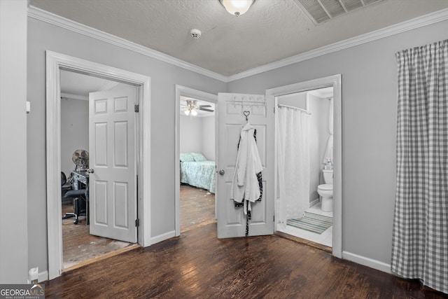 1055 Wrens Hwy, Thomson, GA 30824 - unfurnished bedroom with hardwood / wood-style floors, baseboards, ornamental molding, and a textured ceiling