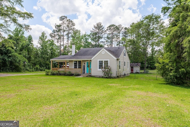 1055 Wrens Hwy, Thomson, GA 30824 - view of front of home featuring a chimney and covered porch
