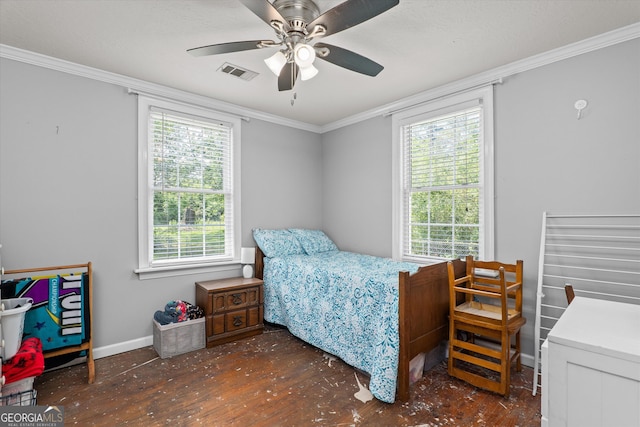 1055 Wrens Hwy, Thomson, GA 30824 - bedroom featuring wood finished floors, crown molding, baseboards, and ceiling fan