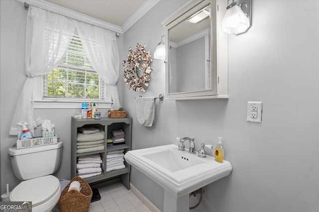 1055 Wrens Hwy, Thomson, GA 30824 - half bathroom with ornamental molding, a sink, toilet, tile patterned flooring, and baseboards