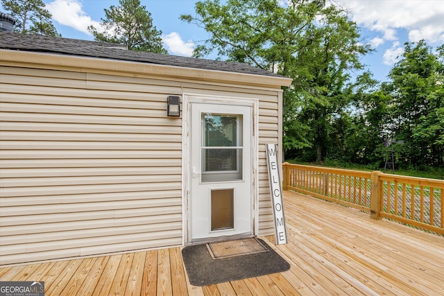 1055 Wrens Hwy, Thomson, GA 30824 - doorway to property with a deck and a shingled roof