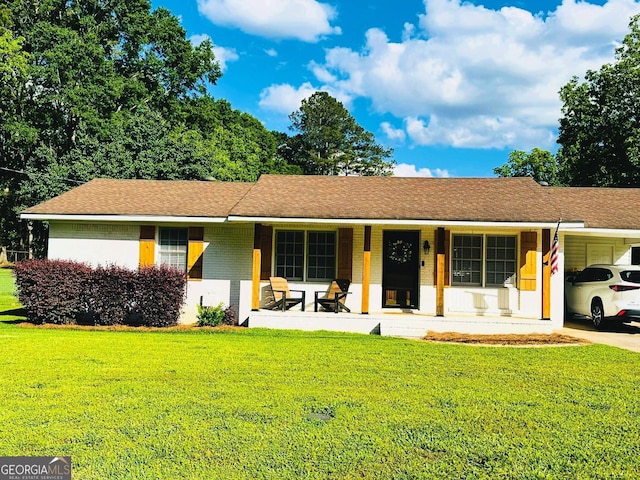 277 N Old Alabama Rd, Thomaston, GA 30286 - single story home with a porch, a front lawn, a carport, and brick siding