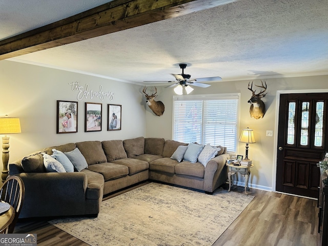 277 N Old Alabama Rd, Thomaston, GA 30286 - living area featuring wood finished floors, a ceiling fan, crown molding, a textured ceiling, and baseboards