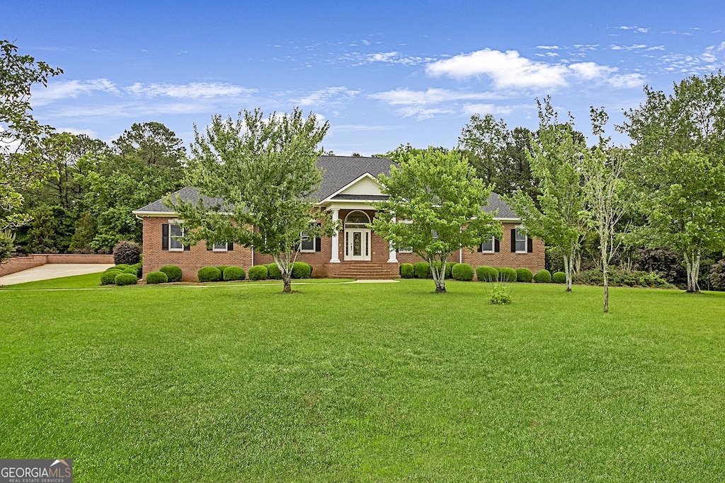 16 Hamil Dr, Macon, GA 31220 - view of property hidden behind natural elements featuring a front lawn and brick siding