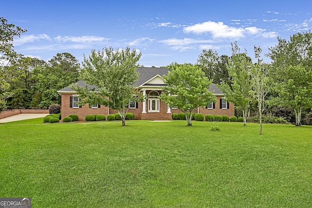 16 Hamil Dr, Macon, GA 31220 - view of property hidden behind natural elements featuring a front lawn and brick siding