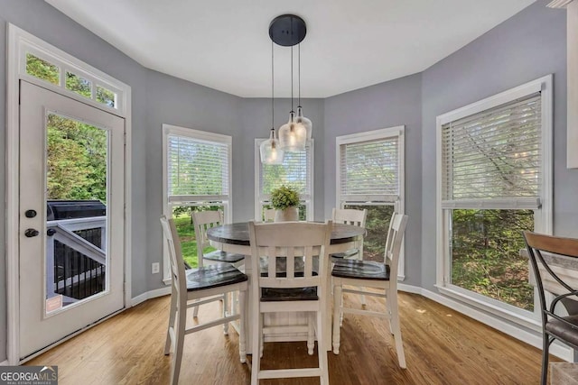 320 Ironhill Trce, Woodstock, GA 30189 - dining room with light wood-type flooring and baseboards