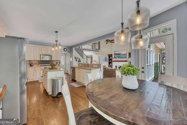 320 Ironhill Trce, Woodstock, GA 30189 - dining space with wood finished floors and ceiling fan