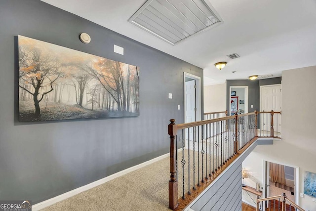 320 Ironhill Trce, Woodstock, GA 30189 - hall with an upstairs landing, carpet flooring, baseboards, and attic access