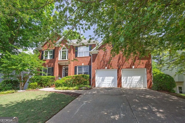 320 Ironhill Trce, Woodstock, GA 30189 - view of front of property with driveway, brick siding, a garage, and a front yard