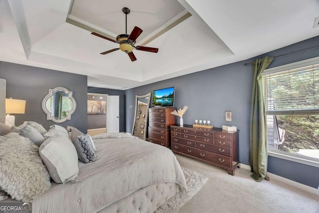 320 Ironhill Trce, Woodstock, GA 30189 - bedroom featuring a raised ceiling, light colored carpet, baseboards, and ceiling fan
