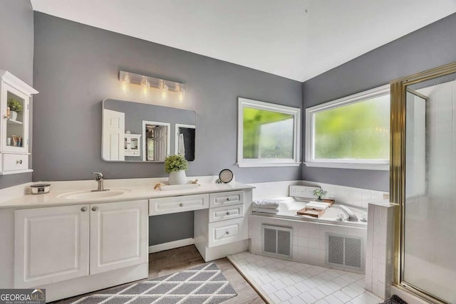320 Ironhill Trce, Woodstock, GA 30189 - full bath featuring vanity, a bath, and a stall shower