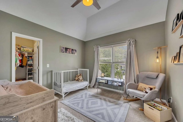 320 Ironhill Trce, Woodstock, GA 30189 - carpeted bedroom with a spacious closet, a ceiling fan, and high vaulted ceiling