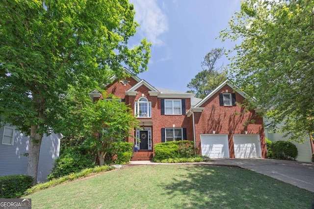 320 Ironhill Trce, Woodstock, GA 30189 - view of front facade with asphalt driveway, brick siding, a front lawn, and a garage