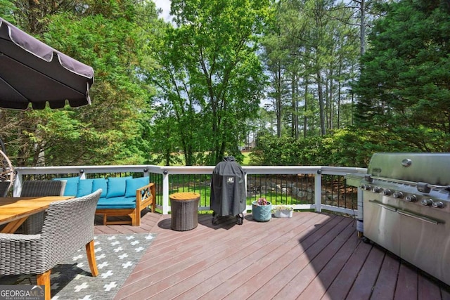320 Ironhill Trce, Woodstock, GA 30189 - wooden deck with an outdoor living space and area for grilling