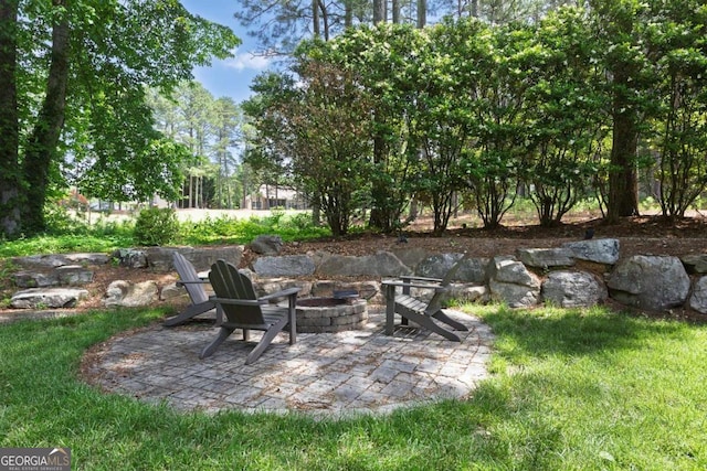 320 Ironhill Trce, Woodstock, GA 30189 - view of patio / terrace featuring an outdoor fire pit