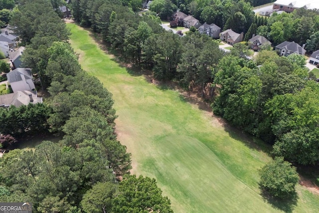 320 Ironhill Trce, Woodstock, GA 30189 - aerial overview of property's location with nearby suburban area, a golf course, and a tree filled landscape