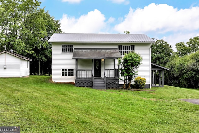 243 Mulkey Rd, Demorest, GA 30535 - rear view of property with a yard, metal roof, and a porch