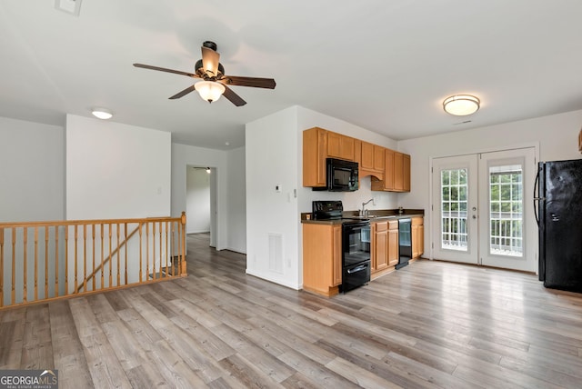 243 Mulkey Rd, Demorest, GA 30535 - kitchen featuring black appliances, a ceiling fan, light wood-type flooring, a sink, and dark countertops