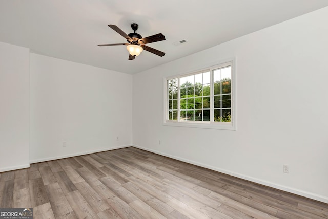 243 Mulkey Rd, Demorest, GA 30535 - empty room with wood finished floors, a ceiling fan, and baseboards