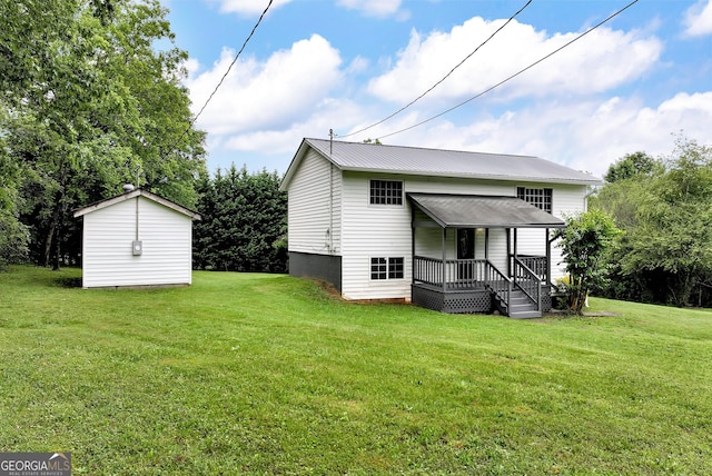 243 Mulkey Rd, Demorest, GA 30535 - back of property featuring a lawn and metal roof