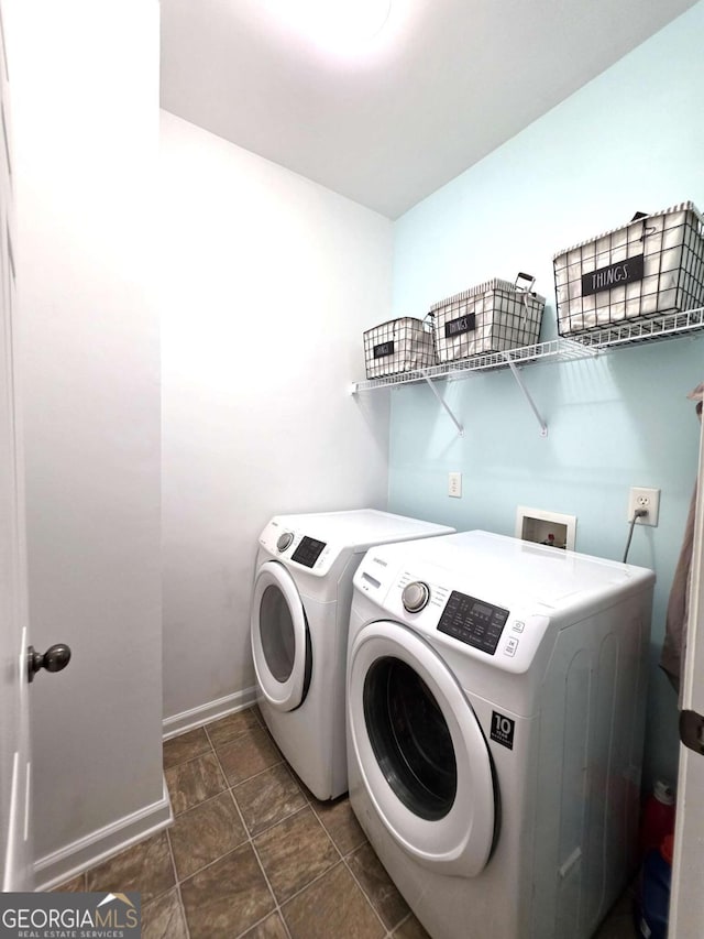2910 Cross Creek Dr, Cumming, GA 30040 - laundry area featuring washer and dryer, baseboards, and stone finish flooring