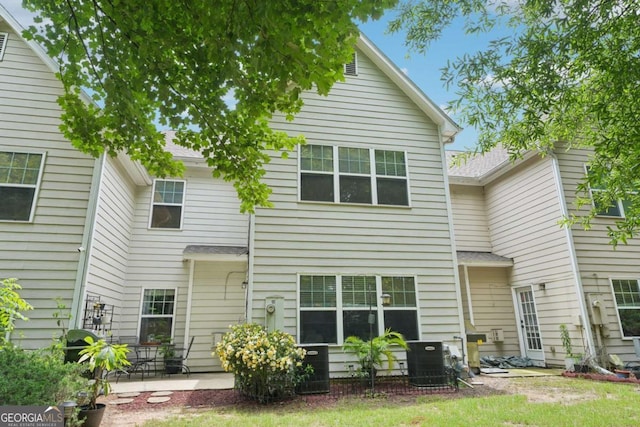 2910 Cross Creek Dr, Cumming, GA 30040 - rear view of house with central AC and a patio area