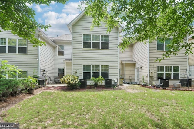 2910 Cross Creek Dr, Cumming, GA 30040 - rear view of house with a yard, a patio, and central air condition unit