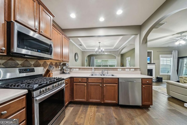 2910 Cross Creek Dr, Cumming, GA 30040 - kitchen featuring appliances with stainless steel finishes, open floor plan, a sink, plenty of natural light, and recessed lighting