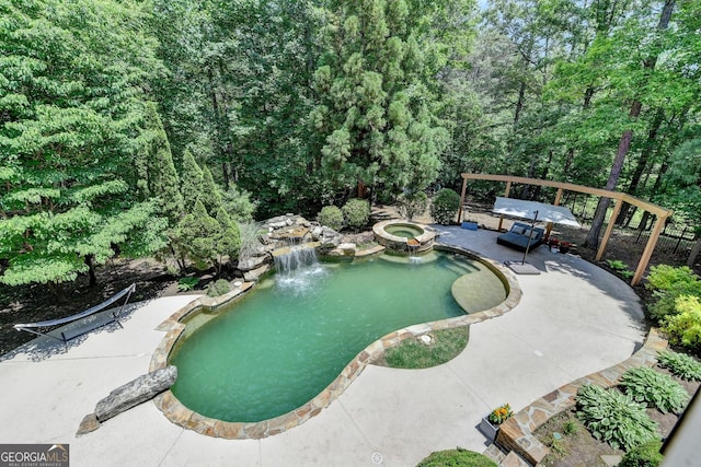 7920 Tintern Trce Unit 298, Duluth, GA 30097 - view of pool with a patio, a pool with connected hot tub, and a garden pond