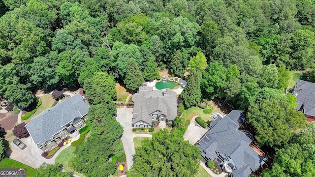 7920 Tintern Trce Unit 298, Duluth, GA 30097 - aerial overview of property's location featuring a heavily wooded area