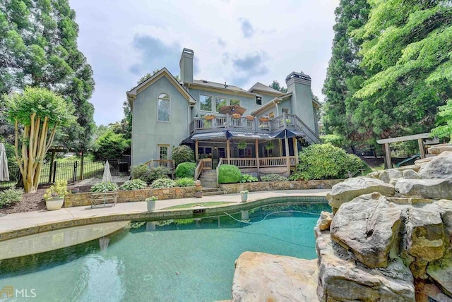7920 Tintern Trce Unit 298, Duluth, GA 30097 - swimming pool featuring stairs and a deck