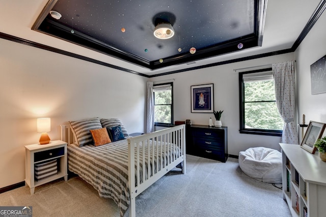 7920 Tintern Trce Unit 298, Duluth, GA 30097 - bedroom with light colored carpet, ornamental molding, multiple windows, a raised ceiling, and baseboards
