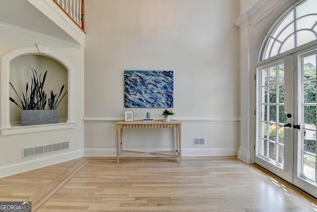 7920 Tintern Trce Unit 298, Duluth, GA 30097 - entrance foyer with a high ceiling, wood finished floors, french doors, and baseboards