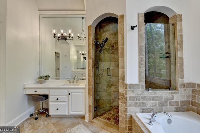 7920 Tintern Trce Unit 298, Duluth, GA 30097 - full bath with a bath, a stall shower, vanity, baseboards, and a chandelier